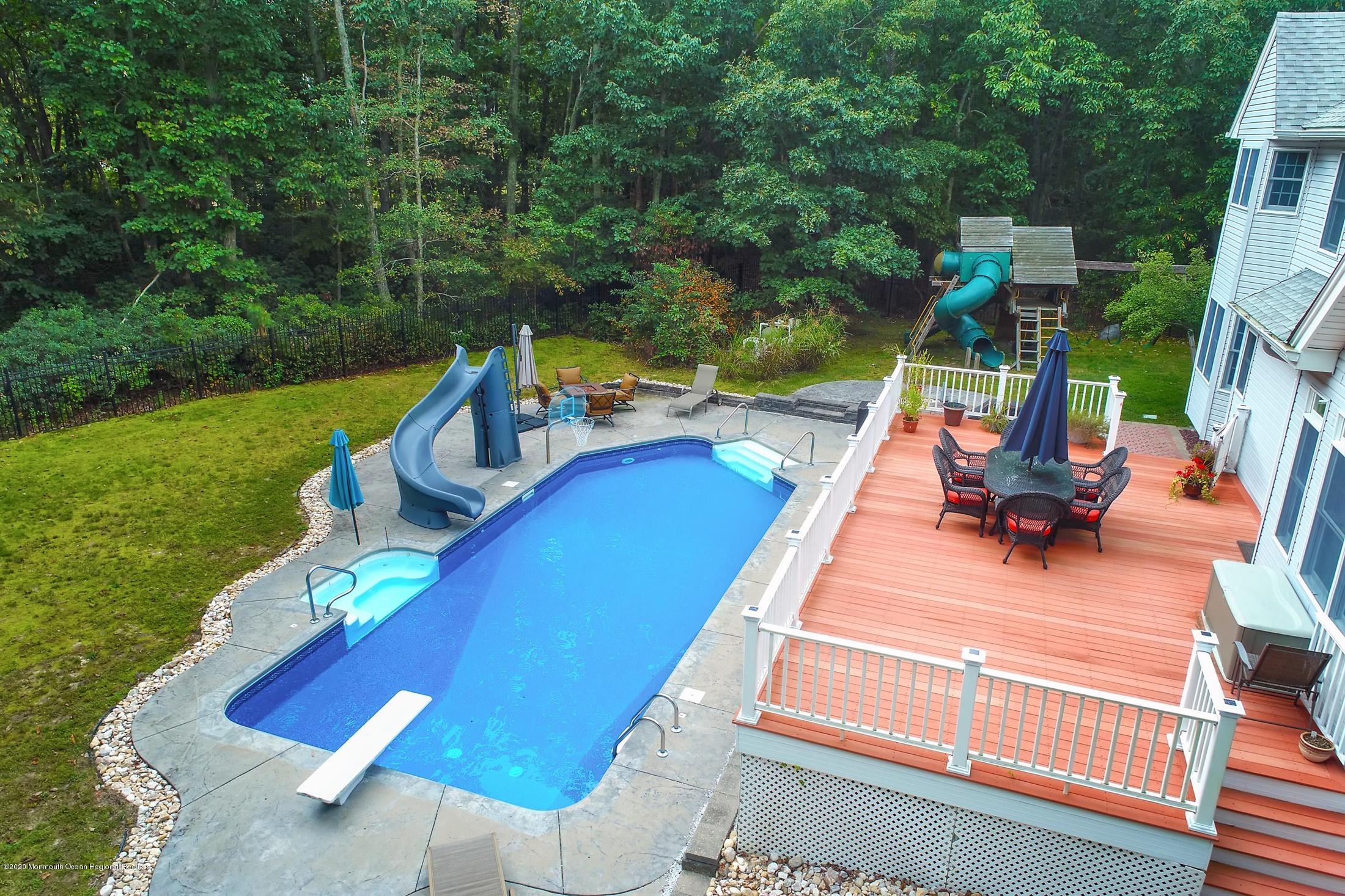 34 Jon Drive Barnegat, NJ 08005 - Photo 6 of 14 a view of a swimming pool with a patio