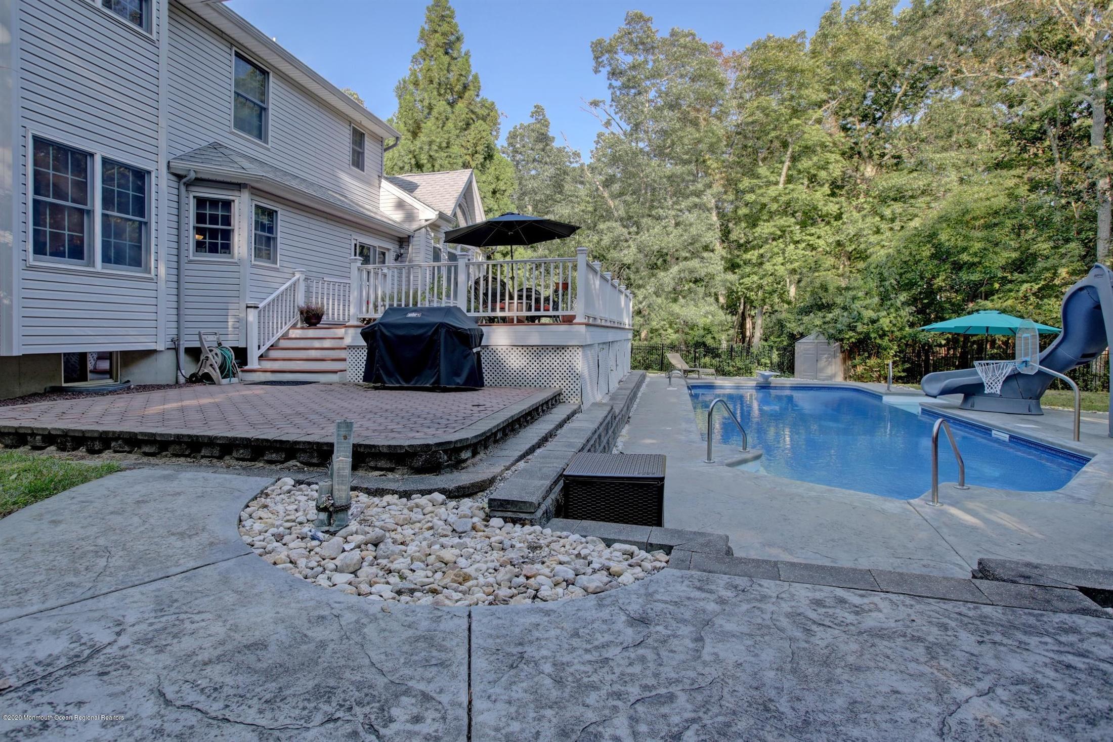 34 Jon Drive Barnegat, NJ 08005 - Photo 7 of 14 a view of a backyard with sitting area