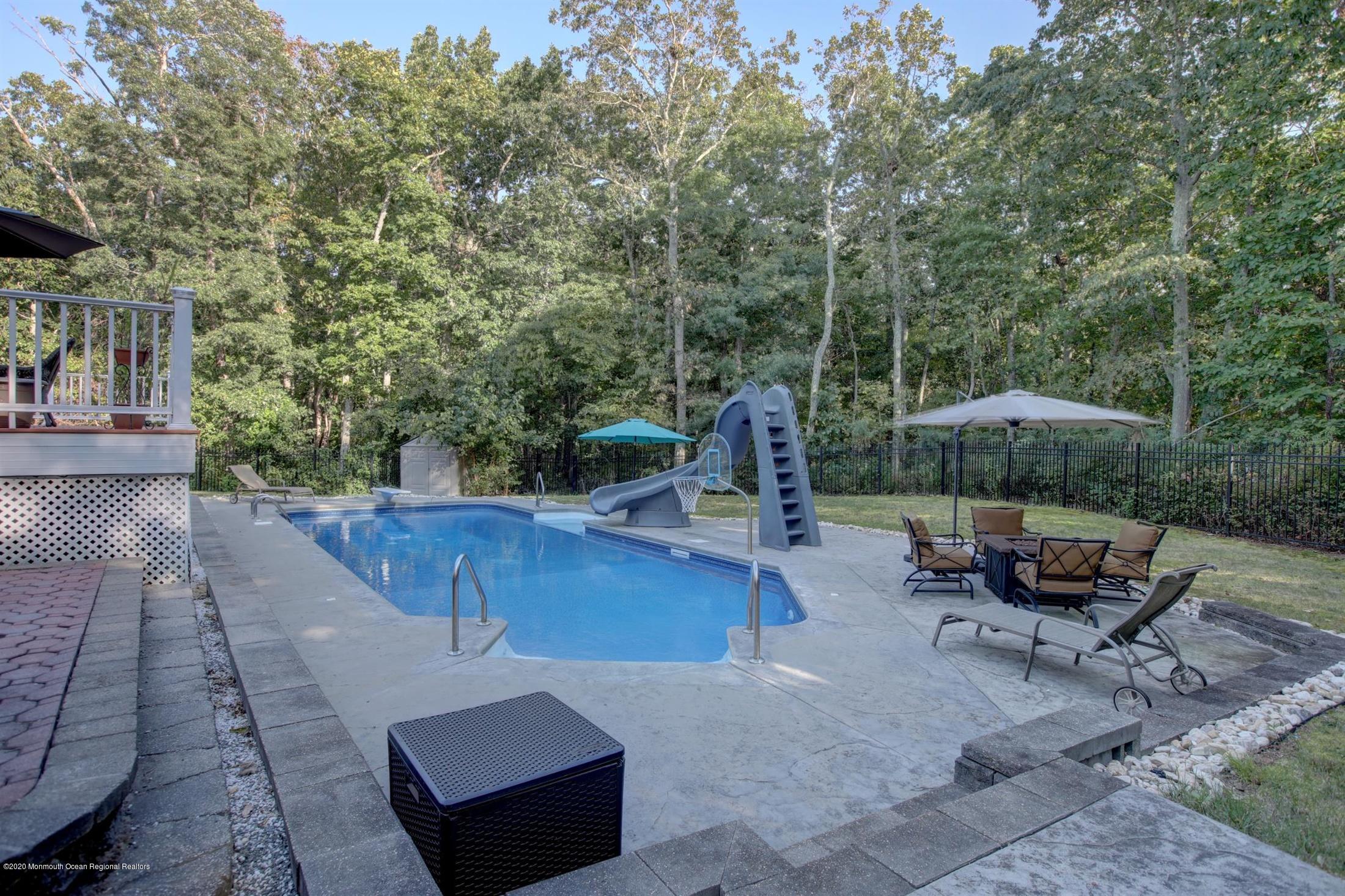 34 Jon Drive Barnegat, NJ 08005 - Photo 8 of 14 a view of a backyard with sitting area