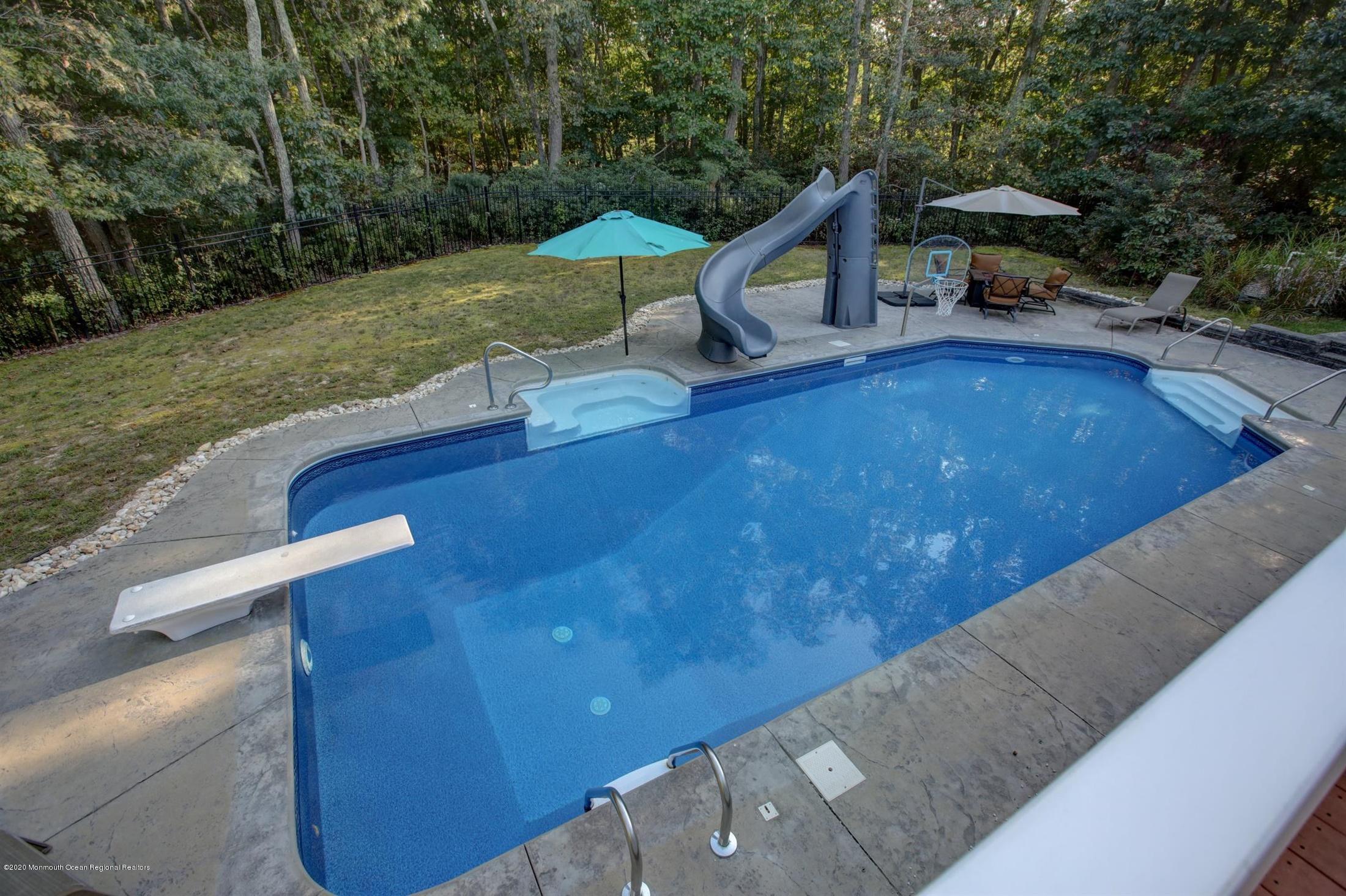 34 Jon Drive Barnegat, NJ 08005 - Photo 9 of 14 a view of a chairs and table in the backyard