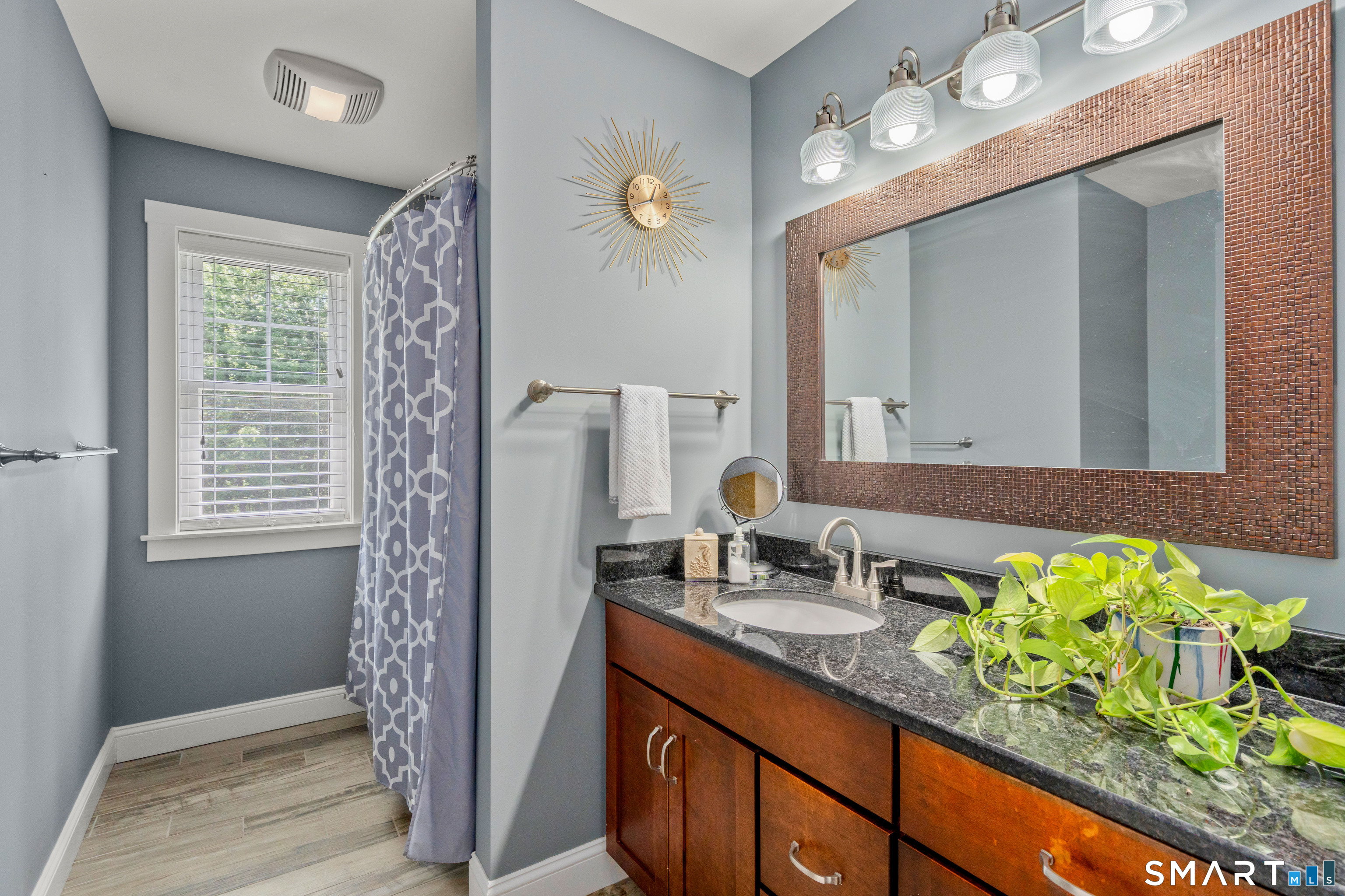 5 Limric Lane Suffield, CT 06078 - Photo 24 of 36 a bathroom with a granite countertop sink and a mirror
