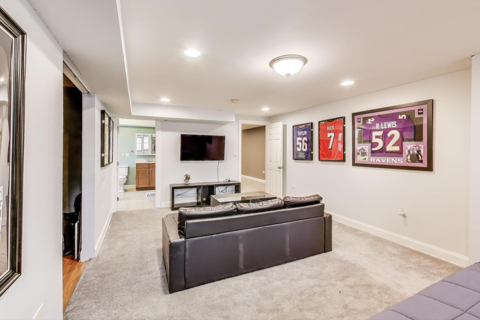 911 Maple Avenue, Unit 1N Evanston, IL 60202 - Photo 24 of 29 a kitchen with stainless steel appliances kitchen island granite countertop a sink and a refrigerator