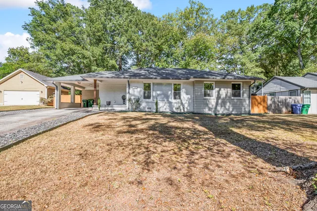 front view of a house with a yard