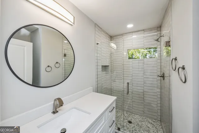 a bathroom with a sink and a mirror