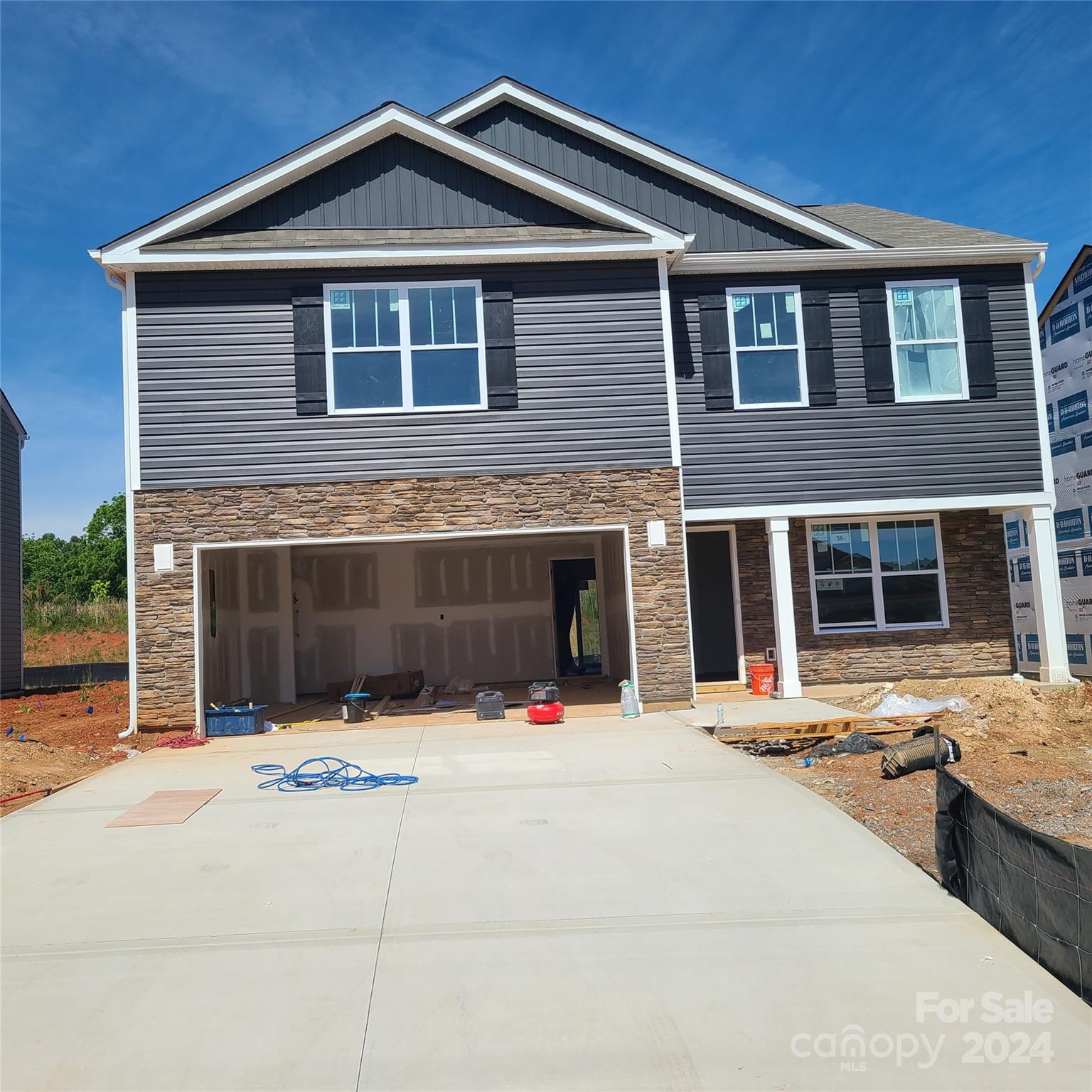 83 Callie River Clyde, NC 28721 - Photo 1 of 26 a view of a house with a yard in the background