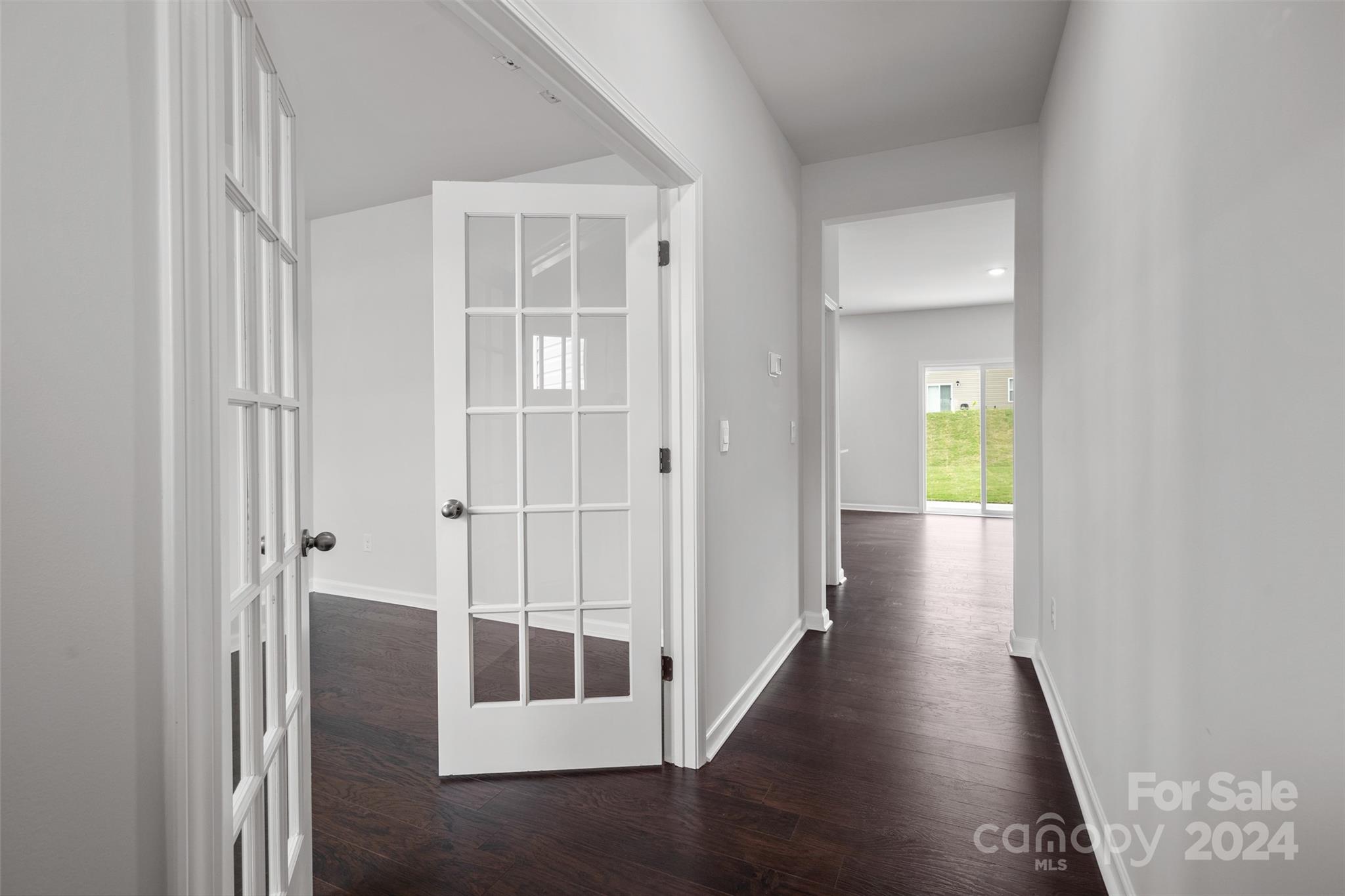 83 Callie River Clyde, NC 28721 - Photo 13 of 26 a view of a hallway with wooden floor and entryway