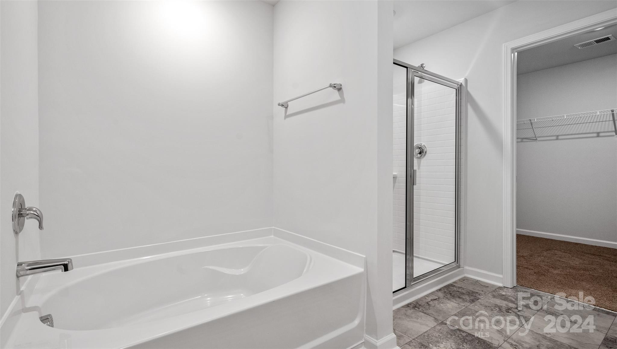 83 Callie River Clyde, NC 28721 - Photo 23 of 26 a bathroom with a tub and shower