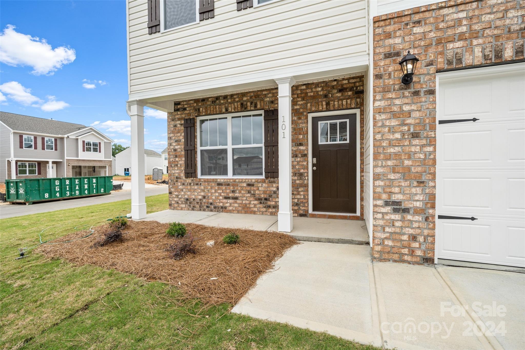 83 Callie River Clyde, NC 28721 - Photo 6 of 26 a front view of a house with a yard and garage