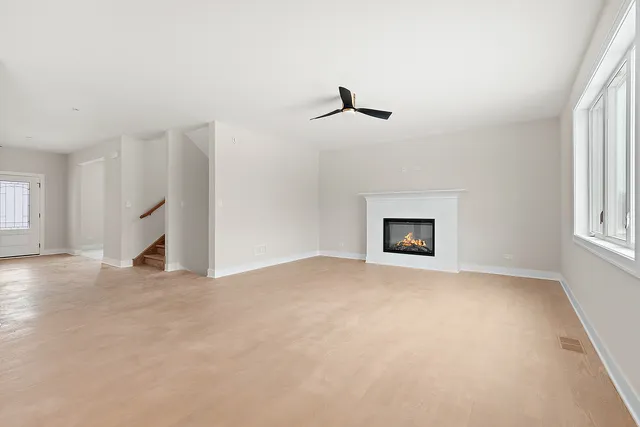 a view of empty room with a fireplace