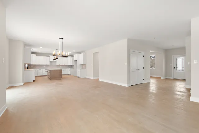 a view of a kitchen with a sink and a window