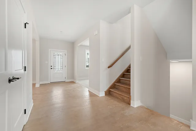 a view of a hallway with staircase