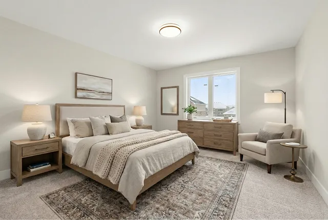 a bedroom with a bed and furniture