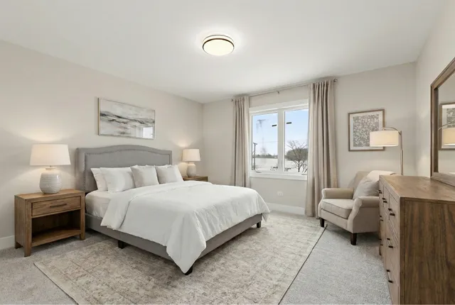 a bedroom with a bed and a couch