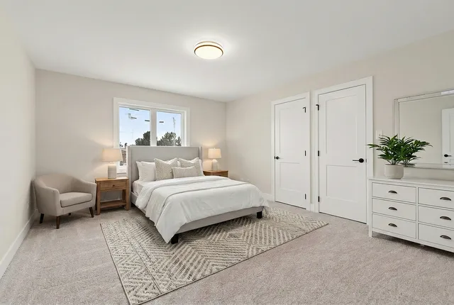 a bedroom with a bed and a couch