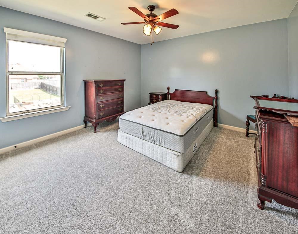 82 Ridgetop Cove Atoka, TN 38004 - Photo 22 of 31 Bedroom with carpet flooring and a ceiling fan