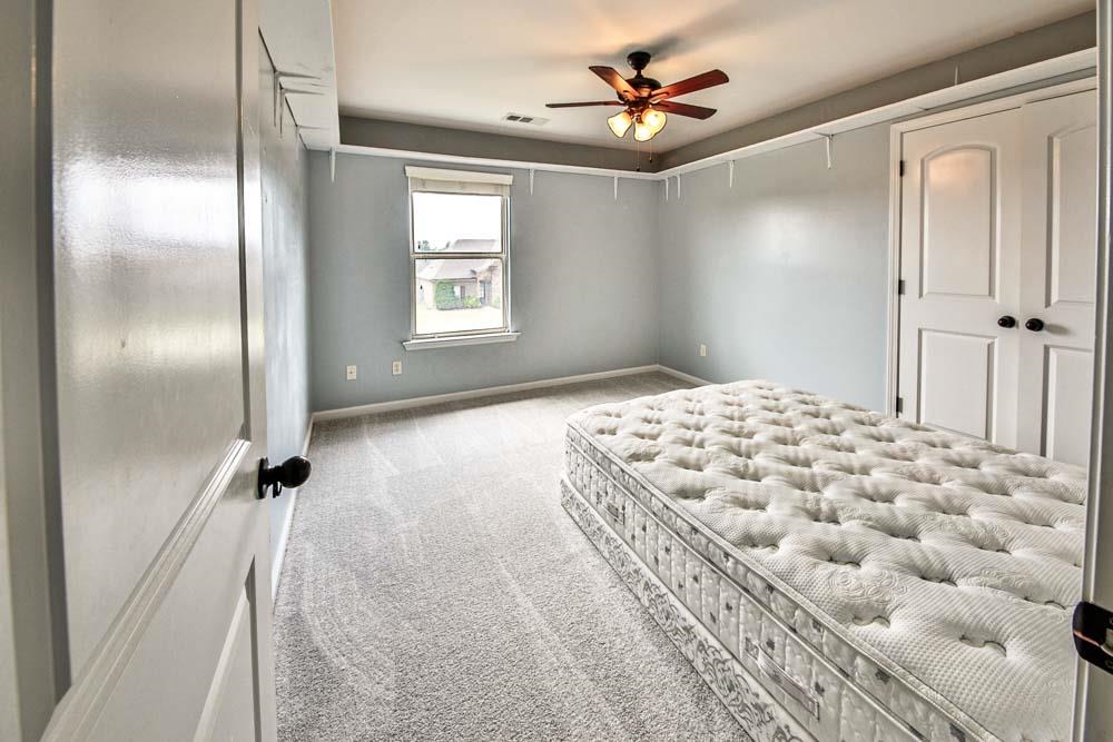 82 Ridgetop Cove Atoka, TN 38004 - Photo 24 of 31 Unfurnished bedroom with carpet flooring and ceiling fan