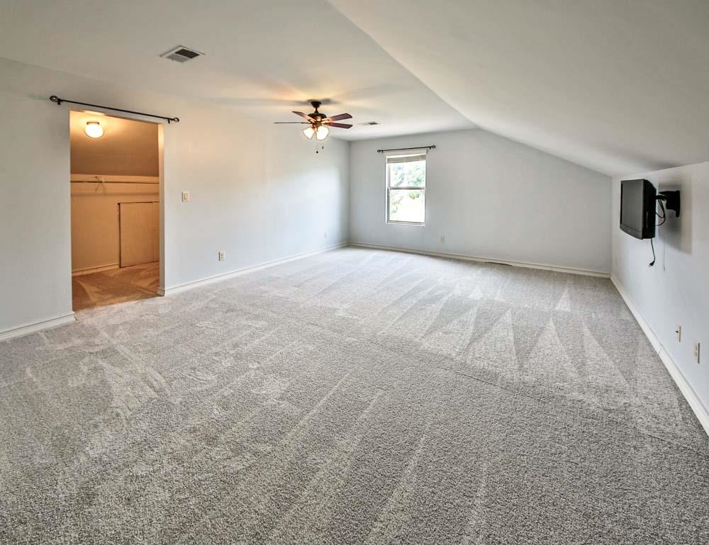 82 Ridgetop Cove Atoka, TN 38004 - Photo 26 of 31 Bonus room featuring carpet floors, a ceiling fan, and vaulted ceiling