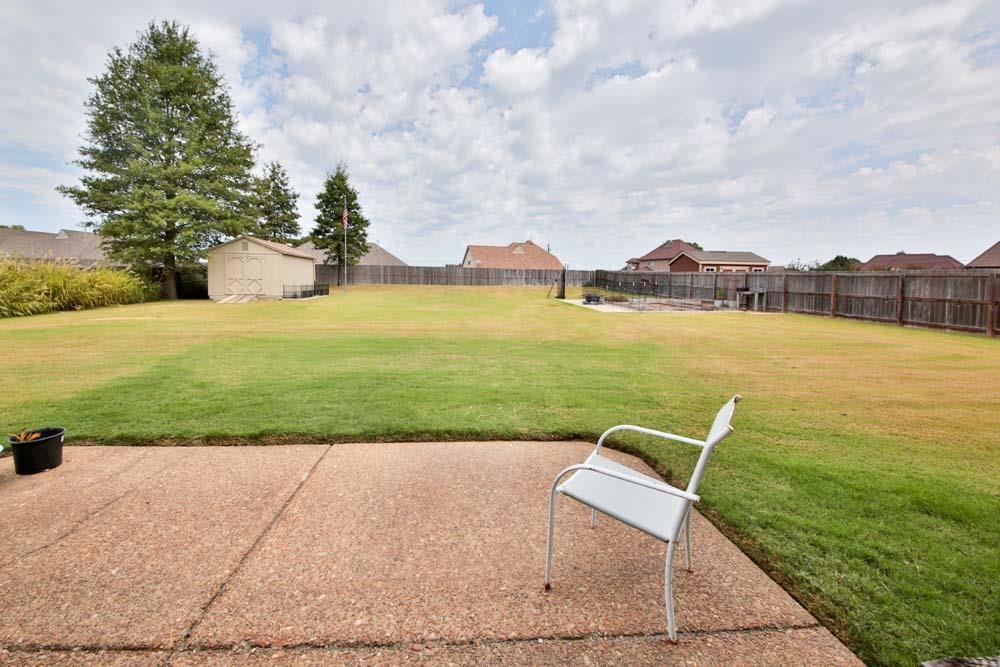 82 Ridgetop Cove Atoka, TN 38004 - Photo 29 of 31 Fenced backyard featuring a storage shed