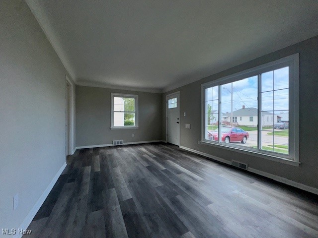 28846 Alton Road Wickliffe, OH 44092 - Photo 16 of 27 Unfurnished living room featuring baseboards, visible vents, and dark wood finished floors