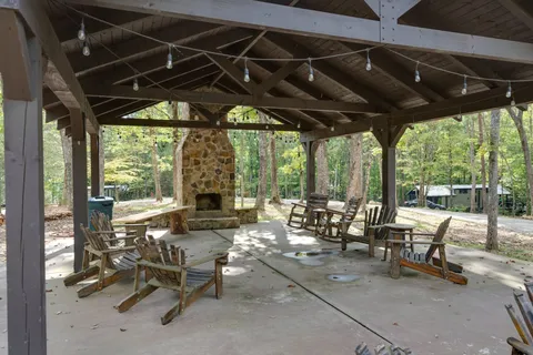 a building outdoor space with patio furniture and garden