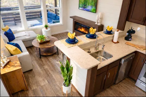 a dining room with furniture and wooden floor