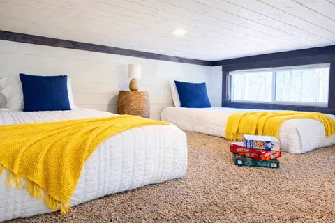 a bedroom with a bed and window