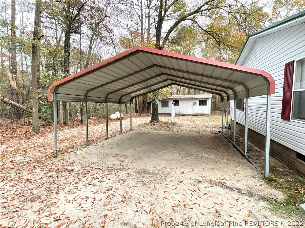 269 Read Road Cameron, NC 28326 - Photo 16 of 21 a view of a house with a yard and wooden fence