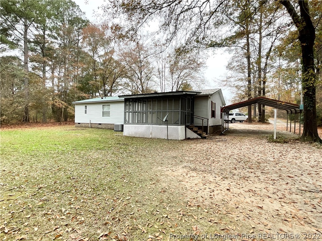 269 Read Road Cameron, NC 28326 - Photo 18 of 21 a front view of a house with garden