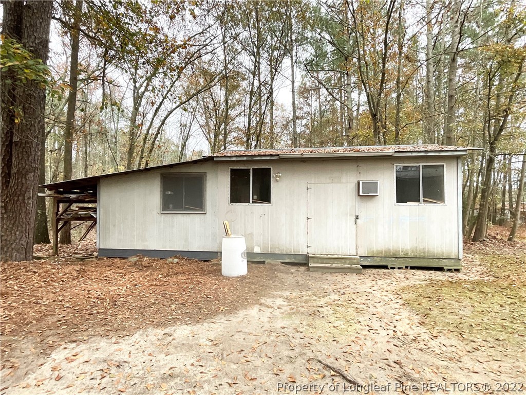 269 Read Road Cameron, NC 28326 - Photo 19 of 21 a front view of a house with a yard