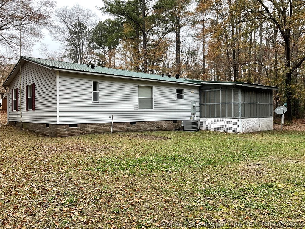 269 Read Road Cameron, NC 28326 - Photo 21 of 21 a backyard of a house with lots of green space
