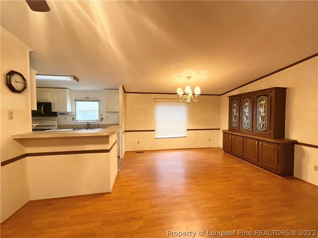 269 Read Road Cameron, NC 28326 - Photo 3 of 21 a view of a kitchen with microwave and refrigerator