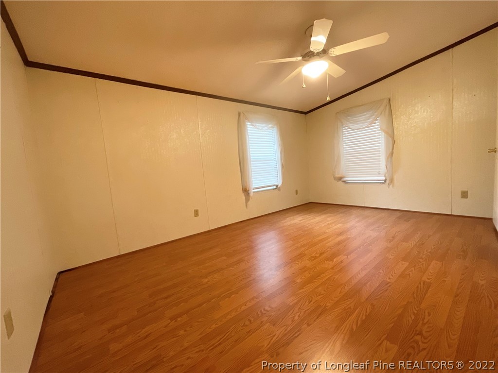 269 Read Road Cameron, NC 28326 - Photo 9 of 21 an empty room with wooden floor and windows