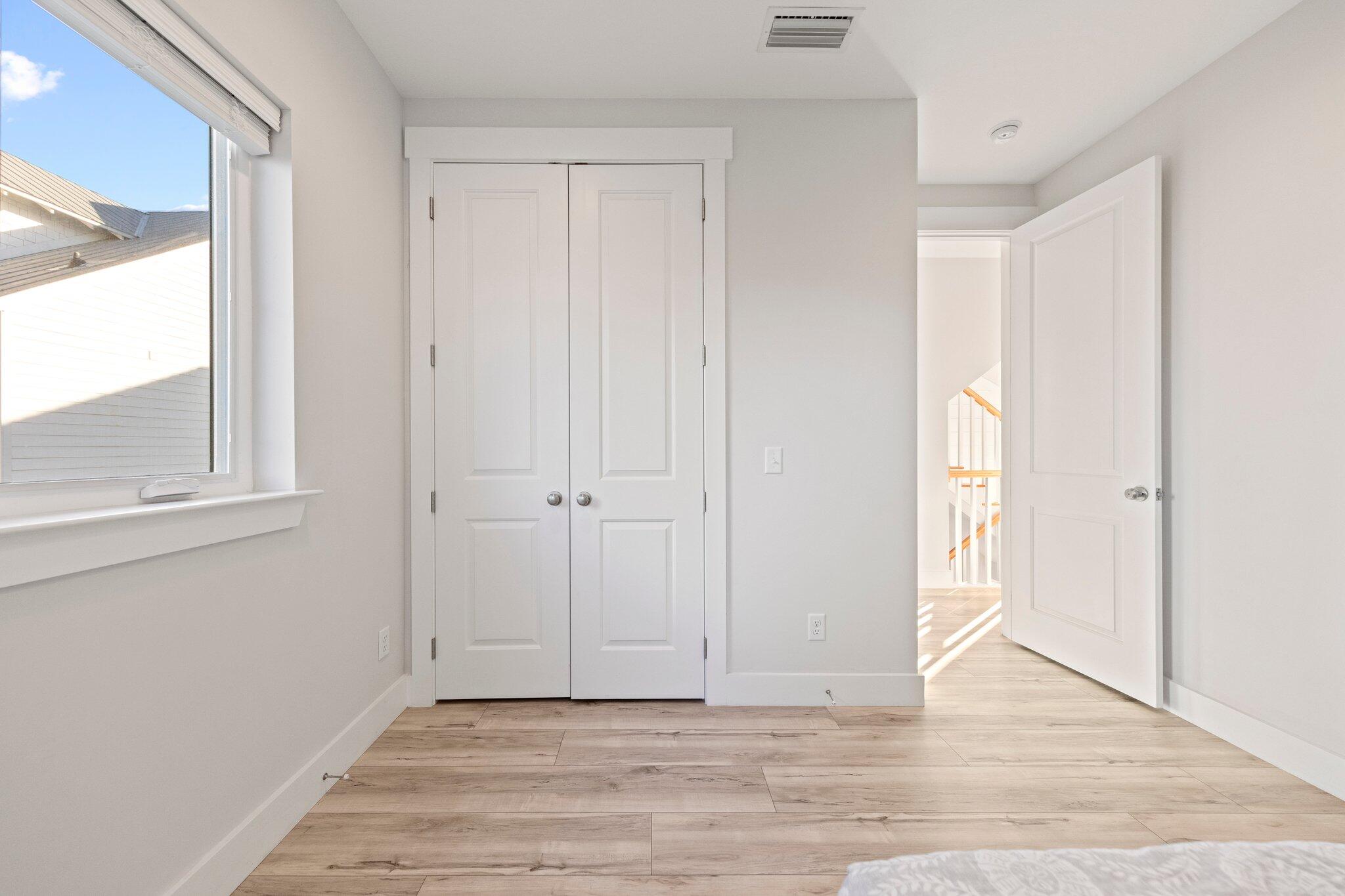 29 Seaview Dr Inlet Beach Inlet Beach, FL 32461 - Photo 20 of 52 a view of an empty room with wooden floor and a window