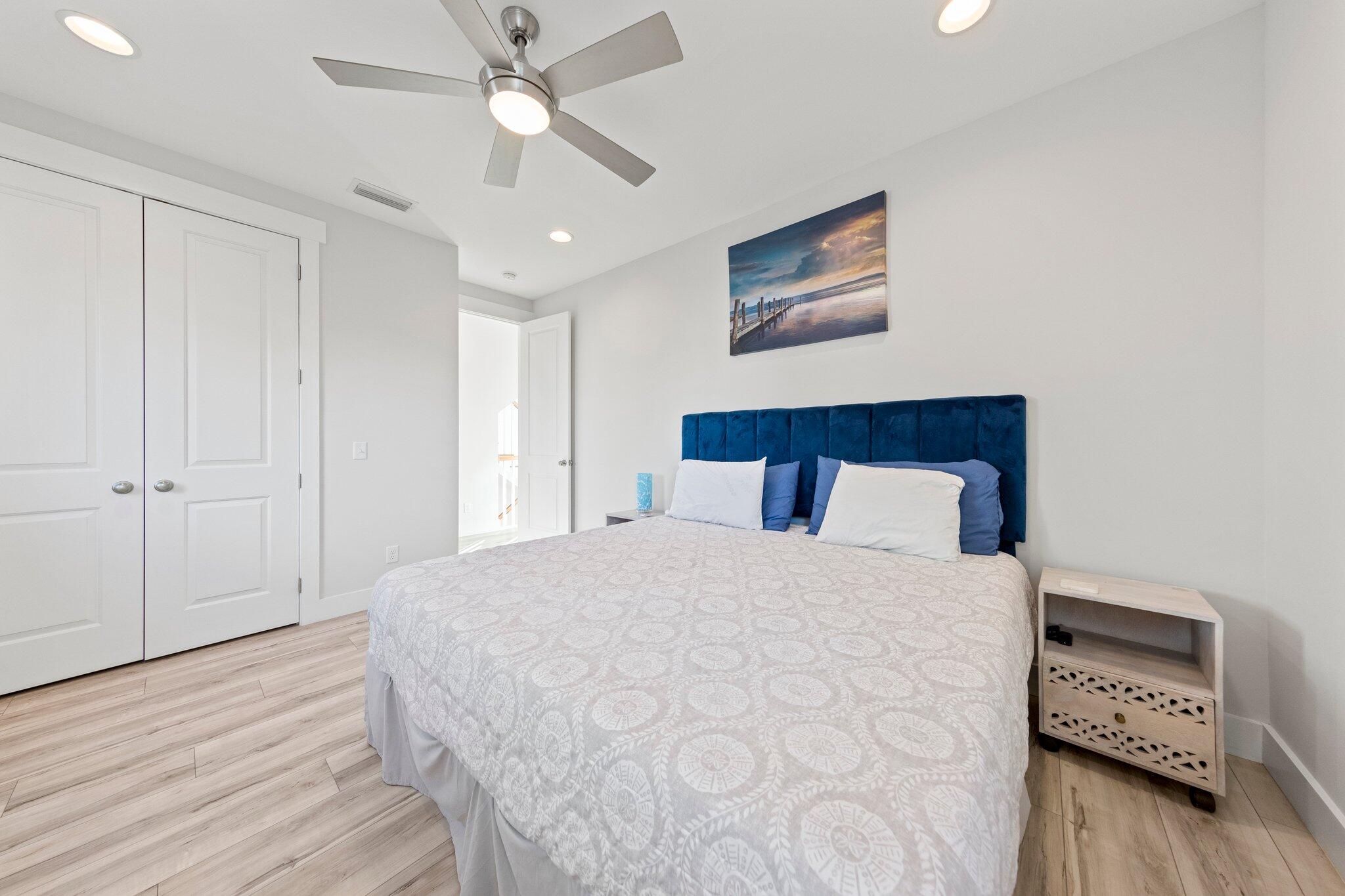 29 Seaview Dr Inlet Beach Inlet Beach, FL 32461 - Photo 21 of 52 a bedroom with a large bed and a chandelier