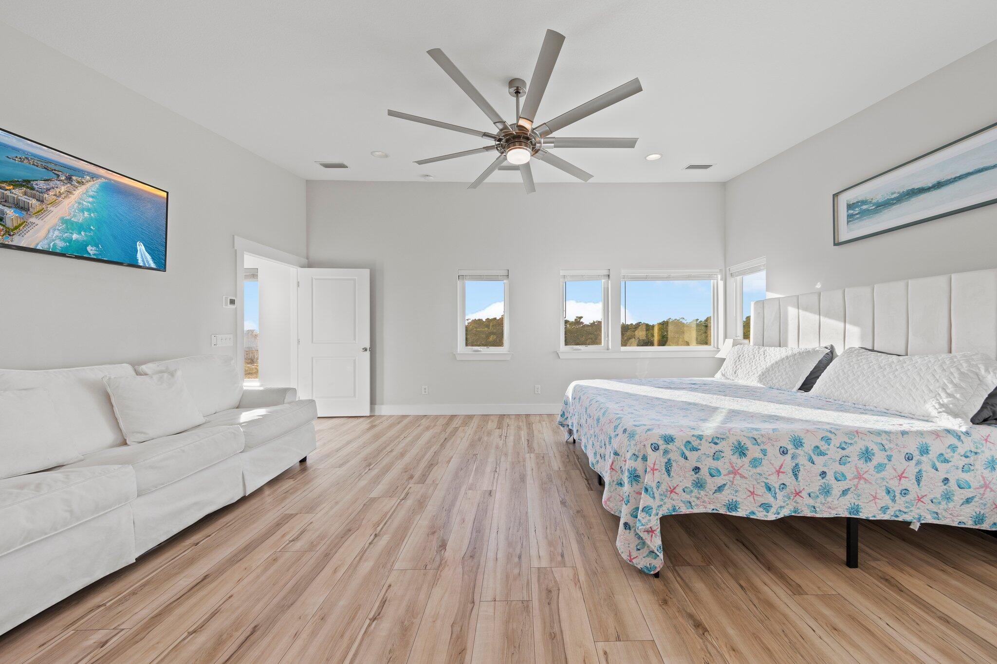 29 Seaview Dr Inlet Beach Inlet Beach, FL 32461 - Photo 35 of 52 a living room with a bed furniture and a wooden floor