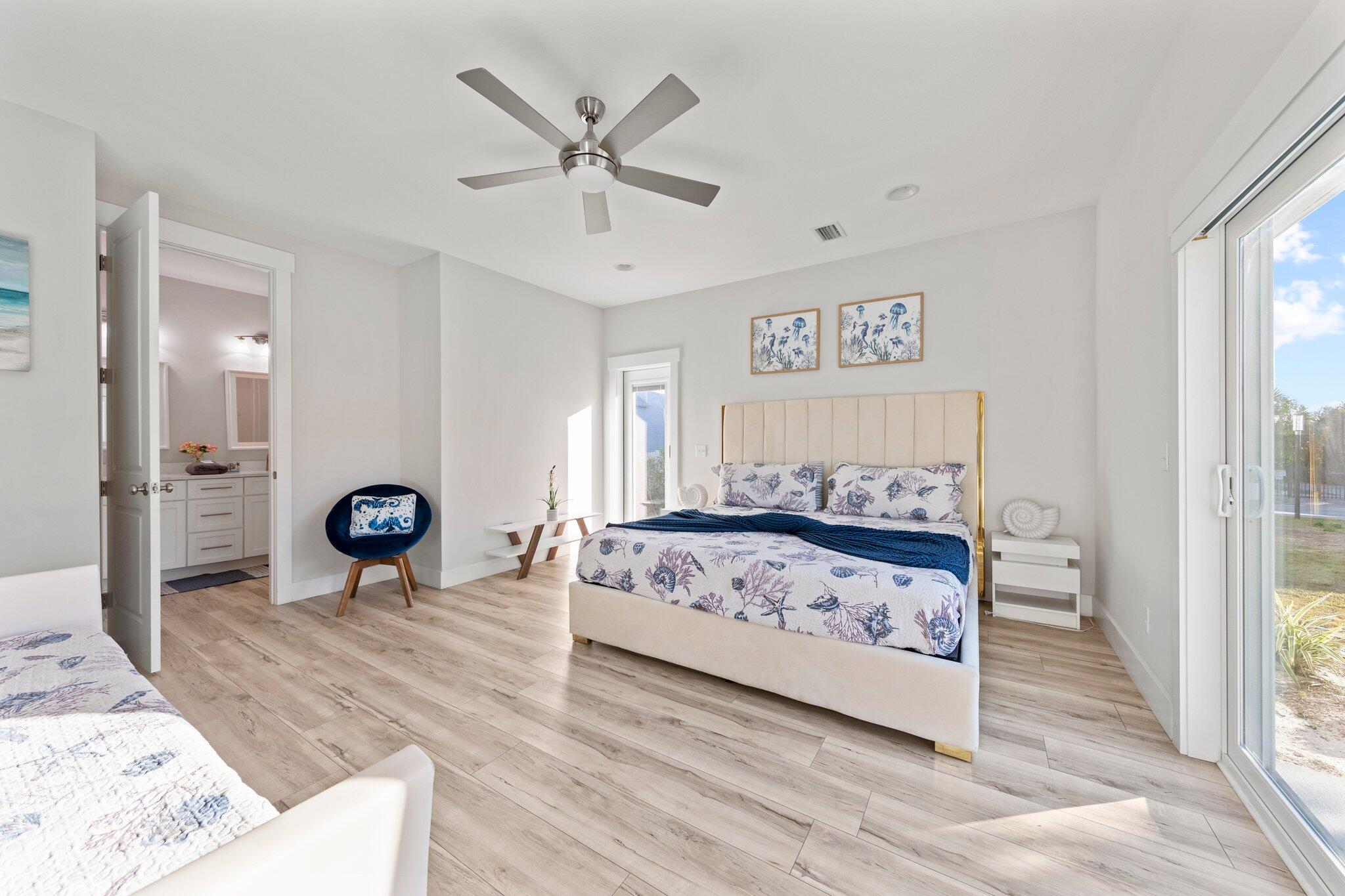 29 Seaview Dr Inlet Beach Inlet Beach, FL 32461 - Photo 8 of 52 a bedroom with a bed and a chandelier