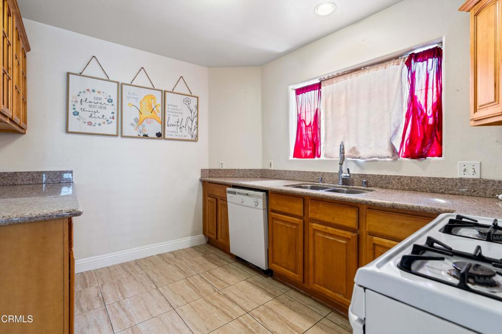 907 West Mission Road, Unit B Alhambra, CA 91801 - Photo 6 of 27 a kitchen with a sink cabinets and a window