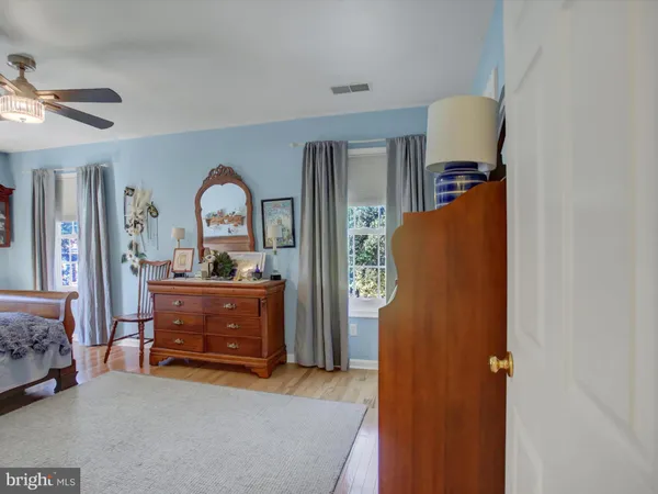 a bedroom with a bed and a table in it