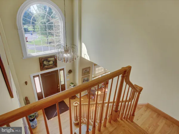 a view of a livingroom with workspace and a window