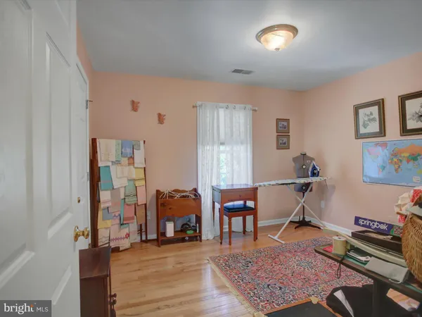 a bedroom with furniture and window