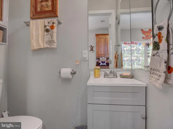 a dining room filled chandelier and wooden floor