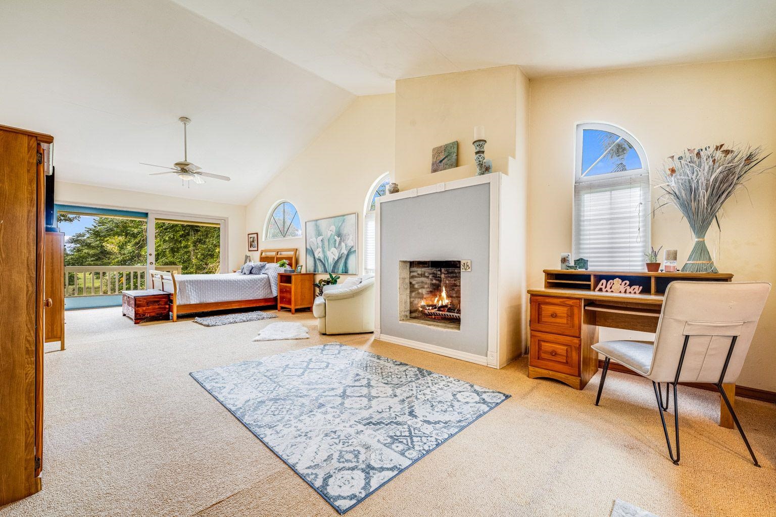 592 Kaupakalua Road Haiku, HI 96708 - Photo 12 of 28 a living room with furniture and a fireplace