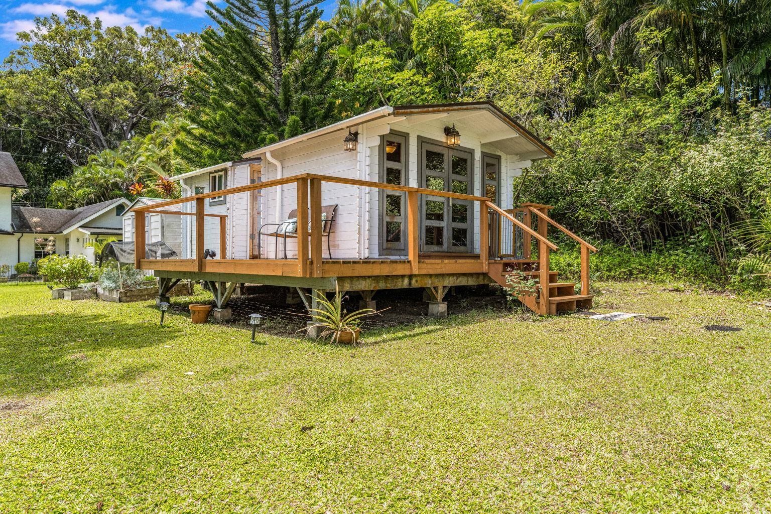 592 Kaupakalua Road Haiku, HI 96708 - Photo 21 of 28 a front view of a house with swimming pool