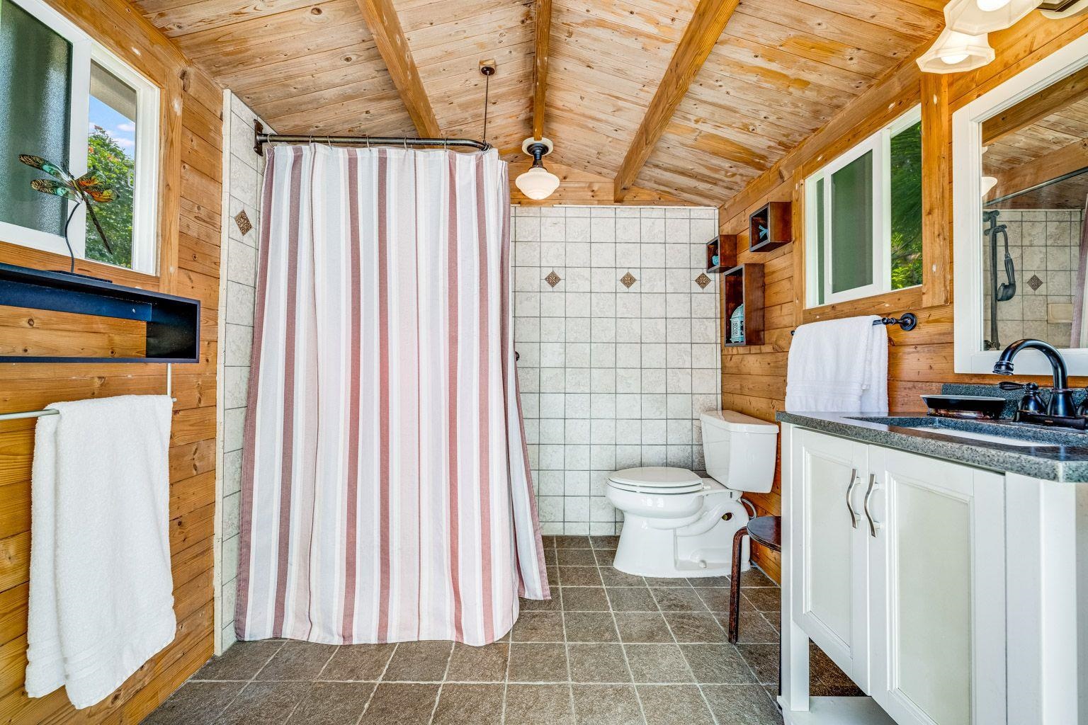 592 Kaupakalua Road Haiku, HI 96708 - Photo 24 of 28 a bathroom with a sink toilet and shower