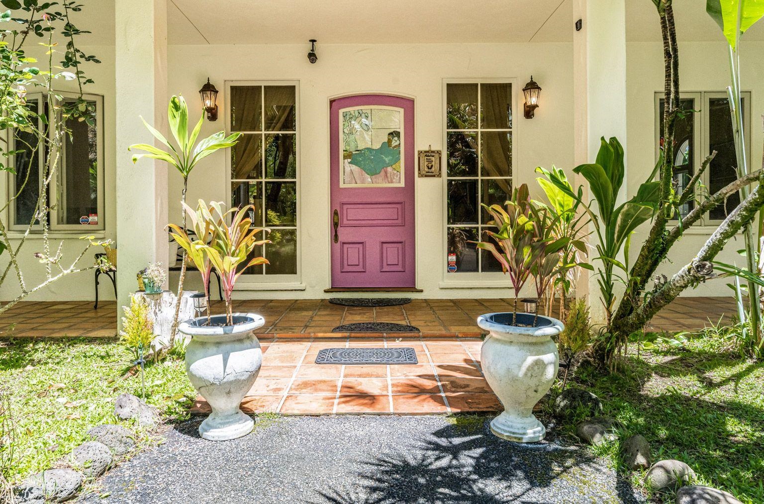 592 Kaupakalua Road Haiku, HI 96708 - Photo 3 of 28 a front view of a house with a yard