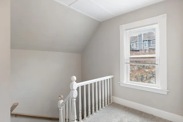 a view of wooden floor and a window