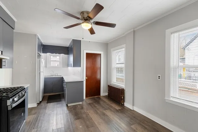 a view of workspace with wooden floor and window
