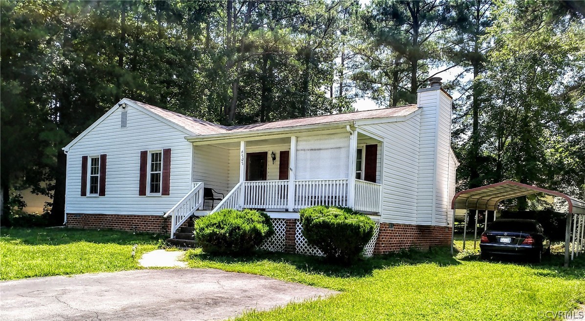 6707 Huntsville Road Chesterfield, VA 23832 - Photo 1 of 17 a front view of a house with a garden and plants