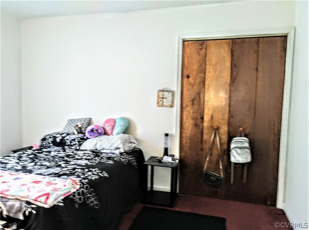 6707 Huntsville Road Chesterfield, VA 23832 - Photo 15 of 17 a bedroom with a bed and a window