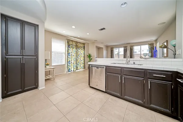 a spacious bathroom with a double vanity sink and a mirror